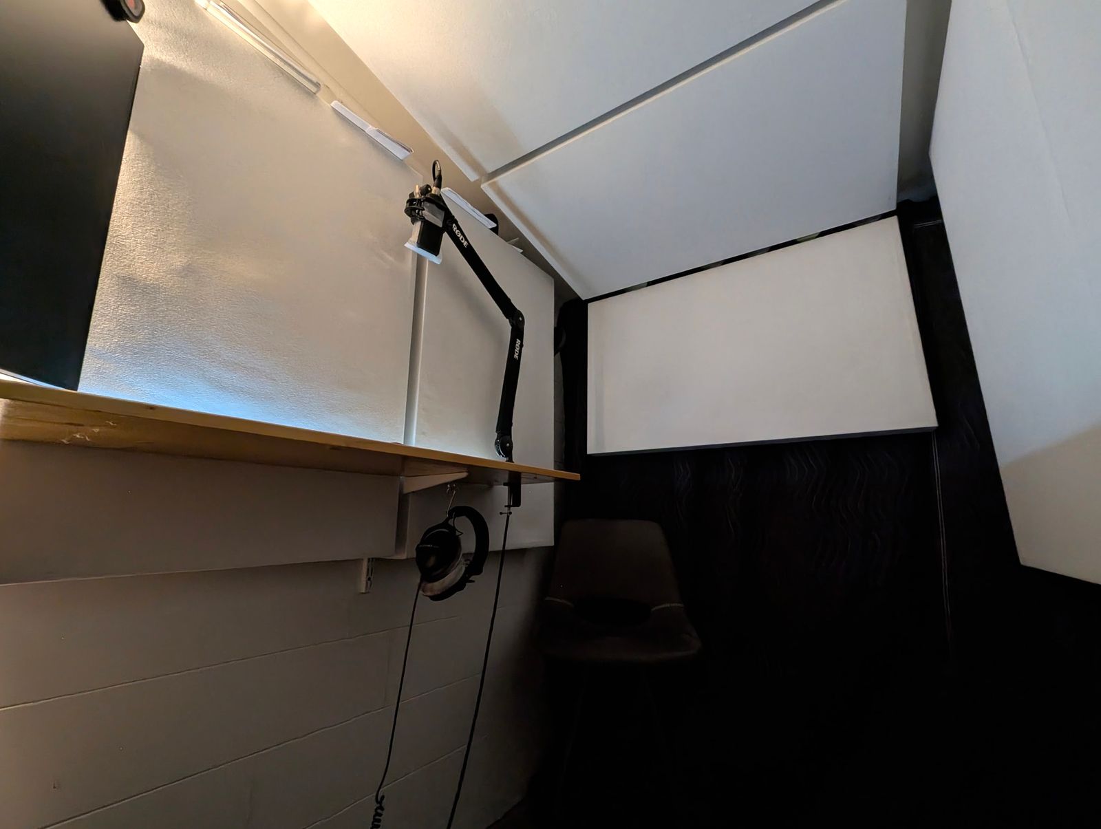 The booth seen from the opposite corner, showing the absorber panels hung overhead.